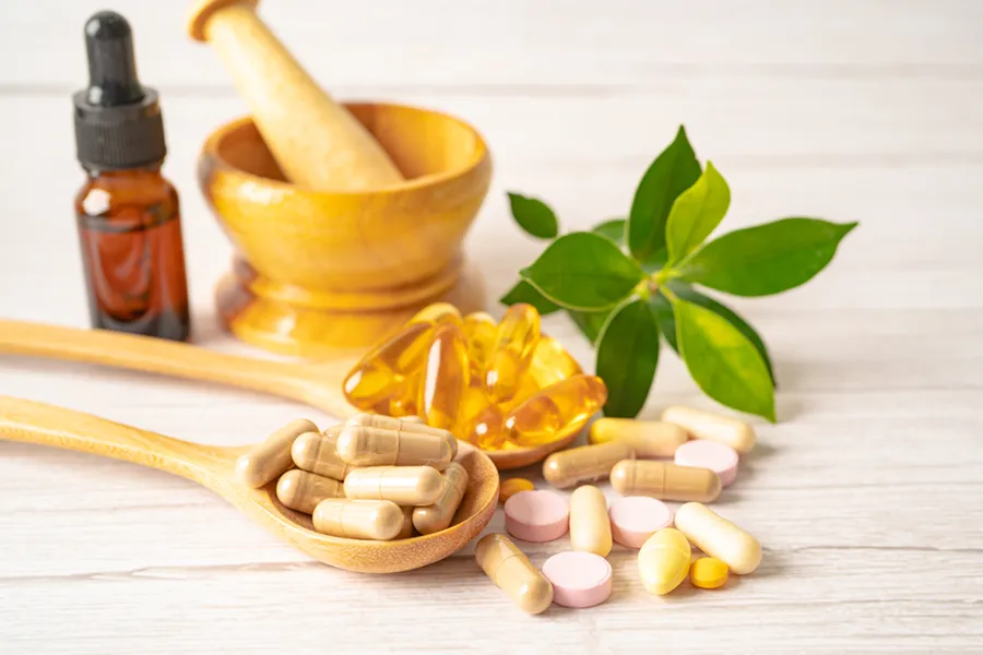 Droppers, capsules, leaves, and a mortar and pestle. Schedule Ayurvedic medicine treatment from Yashoda Singh, MD in Hamilton-Toronto-Niagara.