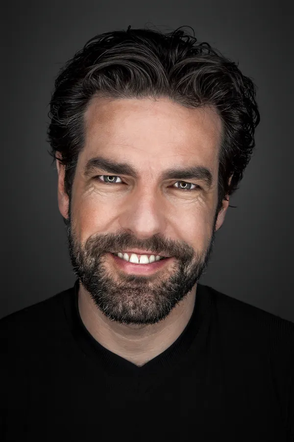 A man with thick, lustrous hair. Get exosomes for hair restoration from Yashoda Singh, MD in Hamilton-Toronto-Niagara.