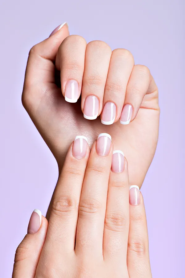 Close-p of hands with beautiful nails. Get nail fungus treatment from Yashoda Singh, MD in Hamilton-Toronto-Niagara.